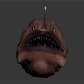 Brown Anglerfish Creature Sculpture With Open Mouth Sharp Teeth And Lure On Head