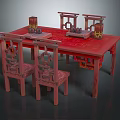 Chinese traditional red table and chair set with carved chairs and decorative tabletop items