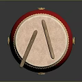 Red Musical Drum Featuring Golden Decorative Rings And Wooden Drumsticks On Surface