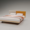 Modern Double Bed with Orange and White Headboard White Mattress Two Pillows and Patterned Blanket