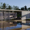 Modern White Slatted Pergola with Water Reflection and Green Trees in Garden