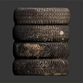 Stack of Used Car Tires with Metal Rims and Worn Tread Surface