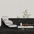 Modern White Single Sofa With Ottoman And Green Plant By Black Fireplace