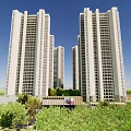Modern High Rise Residential Buildings Exterior With Greenery And Blue Sky