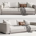 Modern Light Colored Two Seater Sofa with White and Brown Cushions and Patterned Throw Blanket