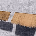 Two Thatch Roof Garden Ornament Structures Against Rough Gray Wall With Shadows