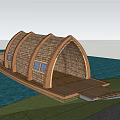 Wooden Boathouse With Arched Thatched Roof Windows Platform Connecting To Land Near Water Grass