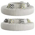 Circular Multi Seat Sofa With Light Gray Upholstery And Geometric Pattern Pillows