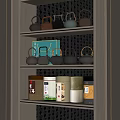 Traditional Tea Set Display On Wooden Shelf With Assorted Teapots And Tea Cans