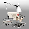Modern Desk Lamp With Stack Of Books Stationery And Drawing On Workspace