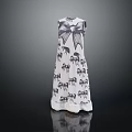 Elegant White Dress With Black Animal Print And Back Bow Design