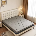 Gray Perforated Mattress On Bed Frame With White Tufted Headboard In Modern Bedroom