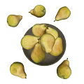 Fresh Yellow Pears in a Bowl with Some Scattered Around on Black Background