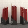 Three Red Stacked Book Art Installations With Golden Frames Black Bases Featuring AZURE Text 3d model