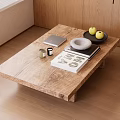 Natural Wooden Coffee Table With Books Fruits Tray And Bowl On Wooden Floor