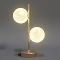 Modern Table Lamp with Circular Golden Frame and Moon Shaped Illuminated Globe on Brown Base