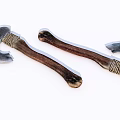 Two Traditional Axes as Weapons with Metal Blades Wooden Handles and Braided Details