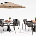 Outdoor Table Set With Black Chairs Umbrella Flower Arrangement And Fruits