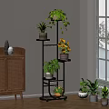 Multi Tiered Black Plant Stand With Green Plants And Yellow Flowers For Indoor Home Decor