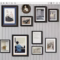 Decorative Gallery Wall with Multiple Framed Artworks and Various Styles on Striped Background 3d model