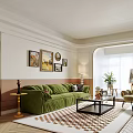 Elegant Living Room Interior With Green Sofa Decorative Paintings Natural Light And Plant