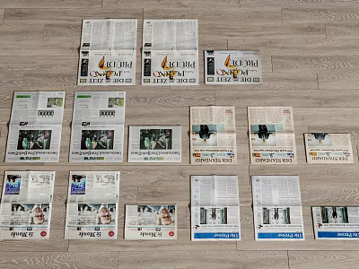 Various Magazines Spread Out On Wooden Floor With Different Covers And Colorful 3d model