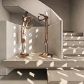 Artistic Sculptures In Modern Interior Staircase With Green Plants And Natural Light
