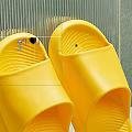 FUSHIA Yellow Slippers Comfortable Slip On Design Soft Rubber Material Against Green Wall And Table