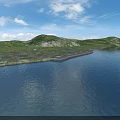 Serene Lakeside Natural Scenery With Calm Blue Water Green Hills White Clouds And Pebbled Shore