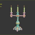 Decorative Candelabra With Three Lit Candles And Colorful Accents On Base