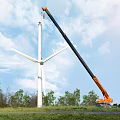 Industrial Equipment Orange Mobile Crane Installing Wind Turbine in Outdoor Grassland Under Blue Sky