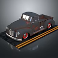 Vintage Rusty Truck With Red Rims On Yellow Striped Display Platform