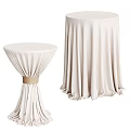 Elegant Round Tables with Ivory Tablecloths Different Heights and Flowy Pleated Design