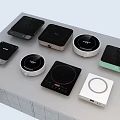 Multiple Modern Induction Cookers Displayed On Kitchen Table With Various Designs 3d model
