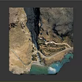 Detailed Mountainous Coastal Terrain With Path Vegetation And Blue Water