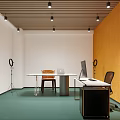 Modern Home Office Interior Featuring Wooden Ceiling Layered Shelves Books Round Desk And Blue Carpet