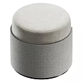 Light Gray Round Ottoman With Soft Fabric Upholstery And Gold Accents