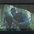 Tropical Rainforest Themed Waterfall Feature Wall With Human Silhouettes And Water Reflection