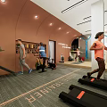 People Exercising In Modern Fitness Gym With Treadmill And Workout Equipment