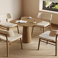 Modern Table And Chairs Set With Round Wooden Table Four Cushioned Chairs On Woven Rug