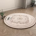 Round Beige Rug with Floral Pattern on Wooden Geometric Floor with Green Plant and Book