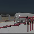 Red and Yellow Industrial Pipes With Large Silver Tank Under Blue Sky At Outdoor Facility