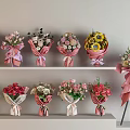 Various Colorful Flower Bouquets Displayed On Shelves And Tripod Stand