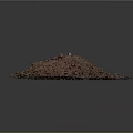 Reddish Brown Soil Pile With Small Stones And Plant Debris Against Dark Background