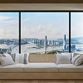 Modern Banquette Sofa With Cushions By Large Windows Overlooking City View