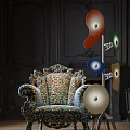 Ornate Vintage Single Sofa With Colorful Floral Upholstery And Multicolored Decorative Lamps