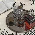Elegant Whiskey Bottle and Crystal Glasses on Silver Tray with Open Book Ice Cubes and Spoon