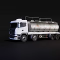 White Utility Tanker Truck With Large Silver Storage Tank And Multiple Wheels