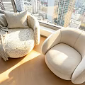 Modern Upholstered Single Sofa With Throw Pillow And Blanket By Large Window City View
