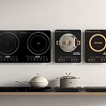 Sleek Kitchen Appliances Featuring Black Wall Mounted Electric Cooktops With Countertop Pots